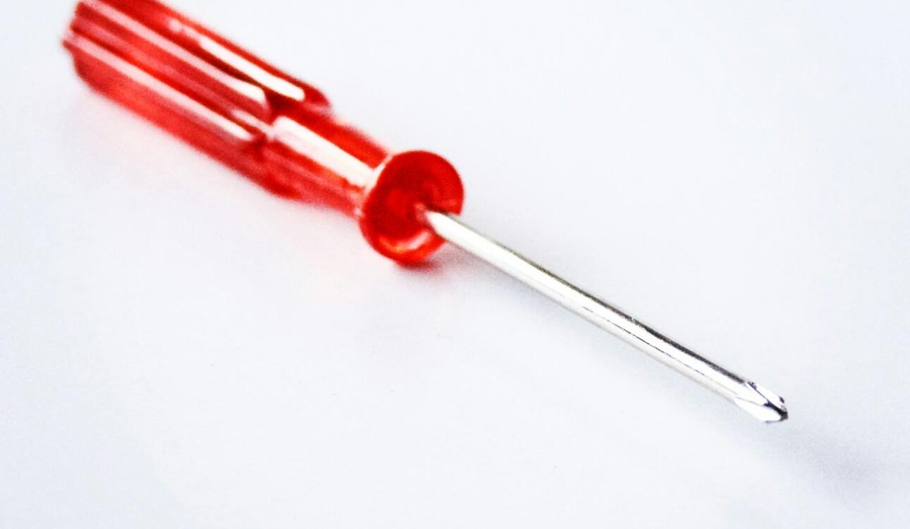 close up photography of red screwdriver